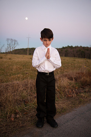 Creepy praying boy