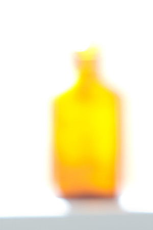 Yellow orange glass bottle