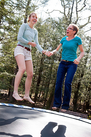 Mom and teen jumping