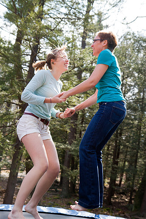 Mom and teen jumping